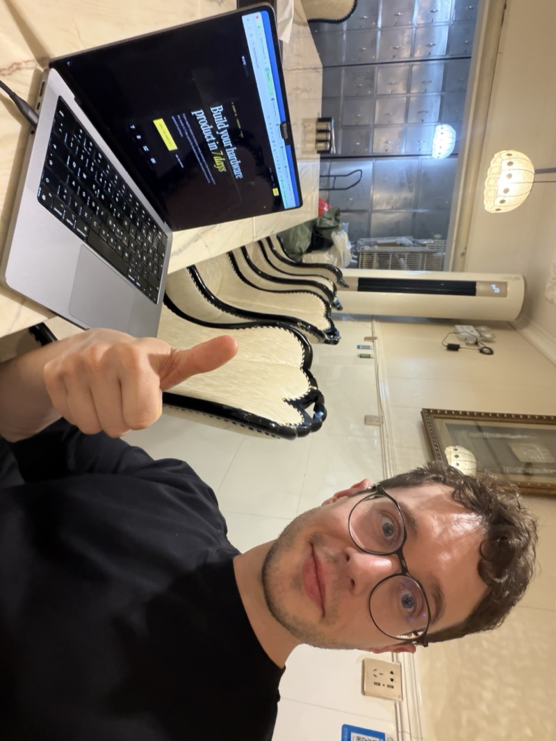 Dominik building the Blitzbuilding page at the dinner table in Shenzhen